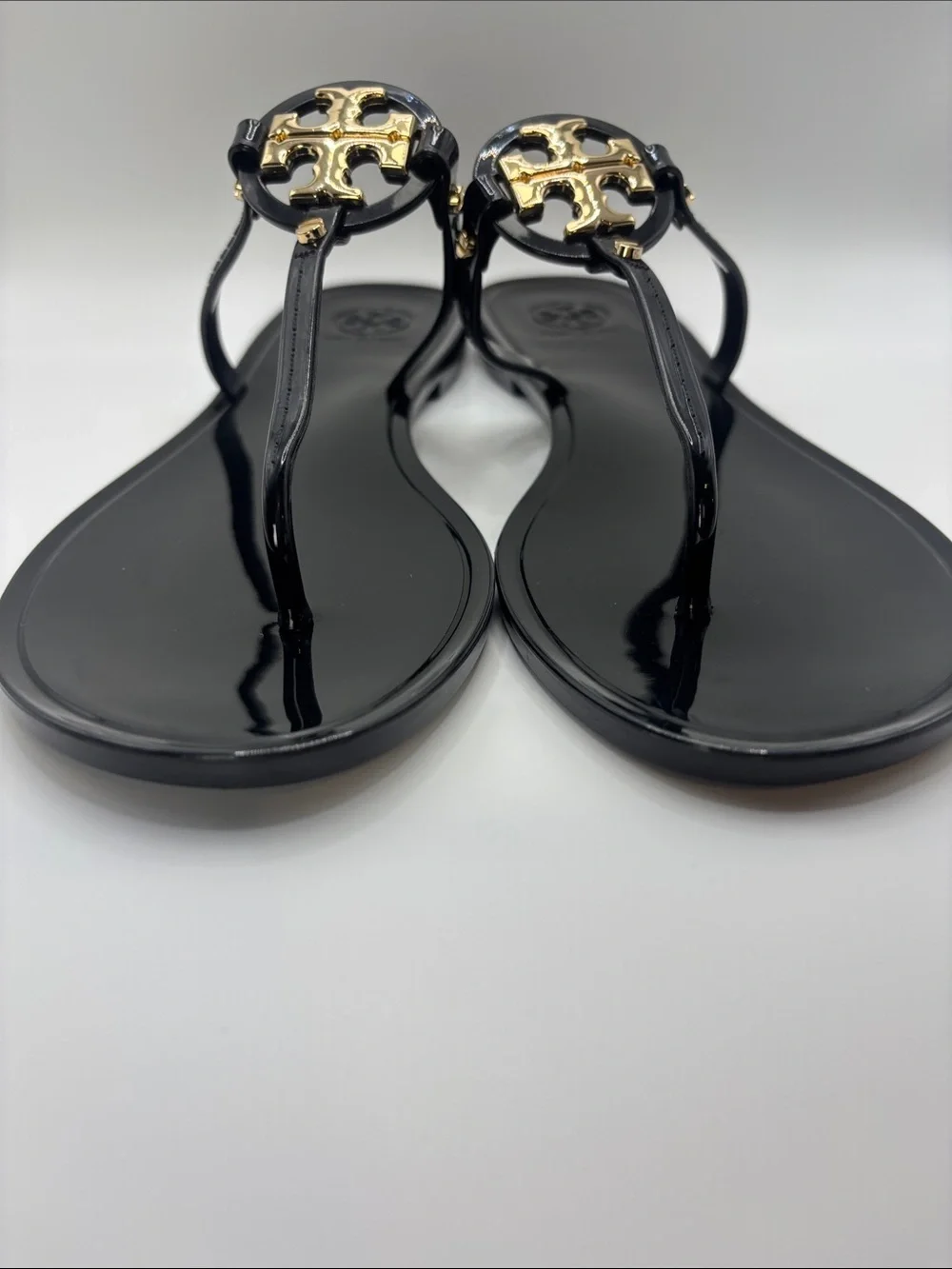 Tory Burch Black Jelly Thong Sandals with Gold Logo Medallions